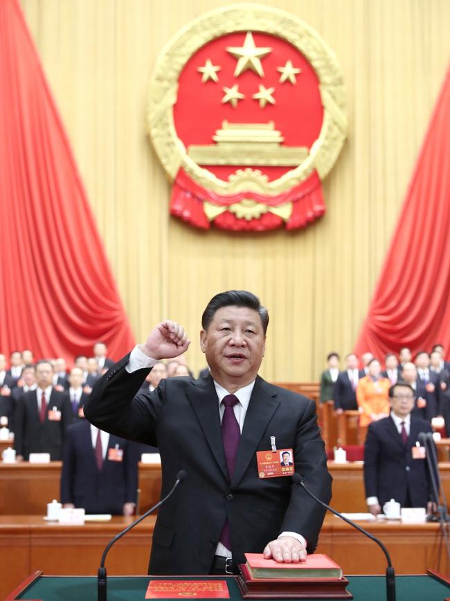 Xi Jinping takes a public oath of allegiance to the Constitution in the Great Hall of the People in Beijing in 2018.