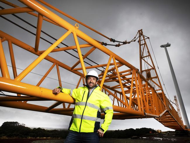 Project director Lyndon Frearson from Ekistica with the tower crane used in Granville Harbour Wind Farm construction on Tasmania’s West Coast. Picture: Chris Kidd