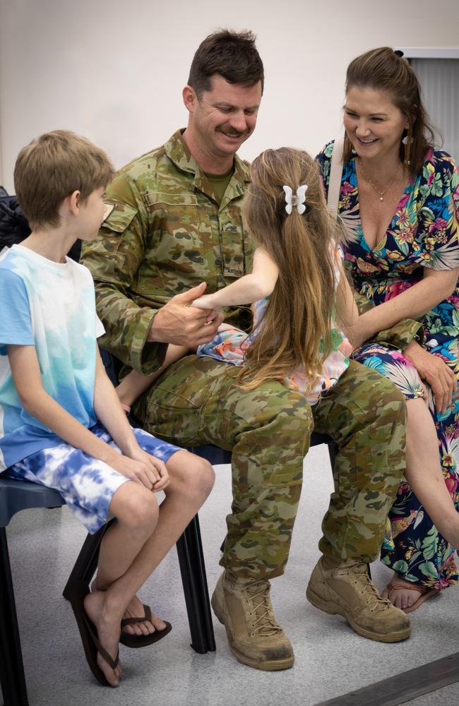 Danial Grieve greets his loved ones after arriving at RAAF Base Darwin following a deployment to the UK on Operation Kudu. Picture: Annie Richardson