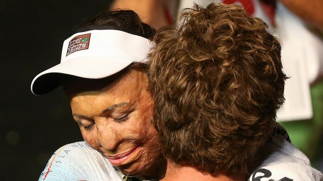 Turia Pitt hugs her partner Michael Hoskin. Pic: Michael Klein