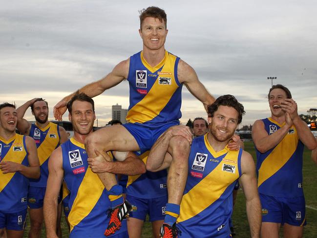 Ben Jolley is given a ride off the ground after playing his 200th VFL match.