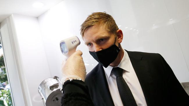 Jack Ziebell of the Kangaroos has his temperature checked before a sanctioned event at NEP Studios, Southbank, in Melbourne. Picture: AFL Media