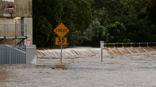 Floodwater gong over the levee wall in Molesworth Street, Lismore in 2017.