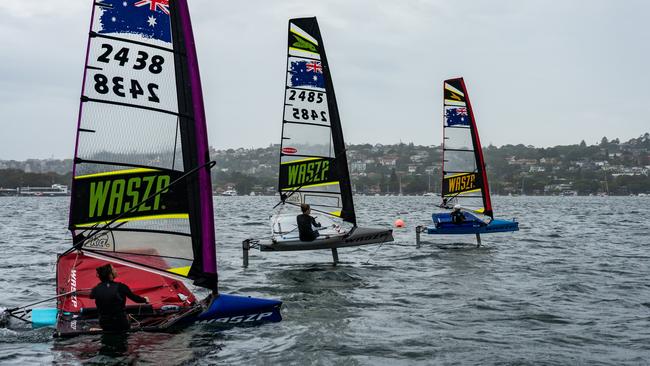 The three women at the selection camp sailing a single-handed foiling boat. Pic: Supplied.