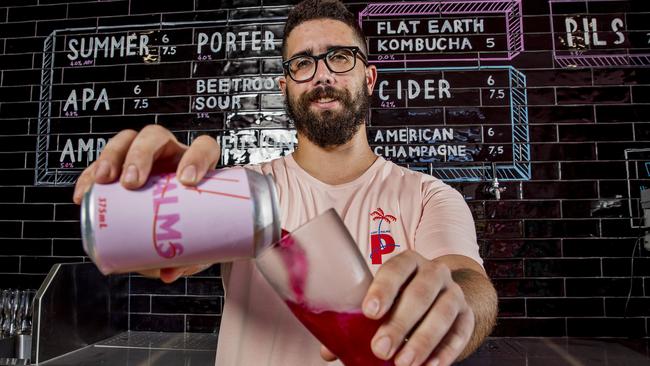 Lost Palms Brewing in Miami owner Jarrod Blanning pours himself a glass. Picture: Jerad Williams