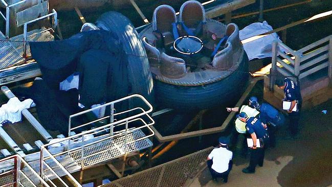 Police inspect the raft after the Dreamworld tragedy.