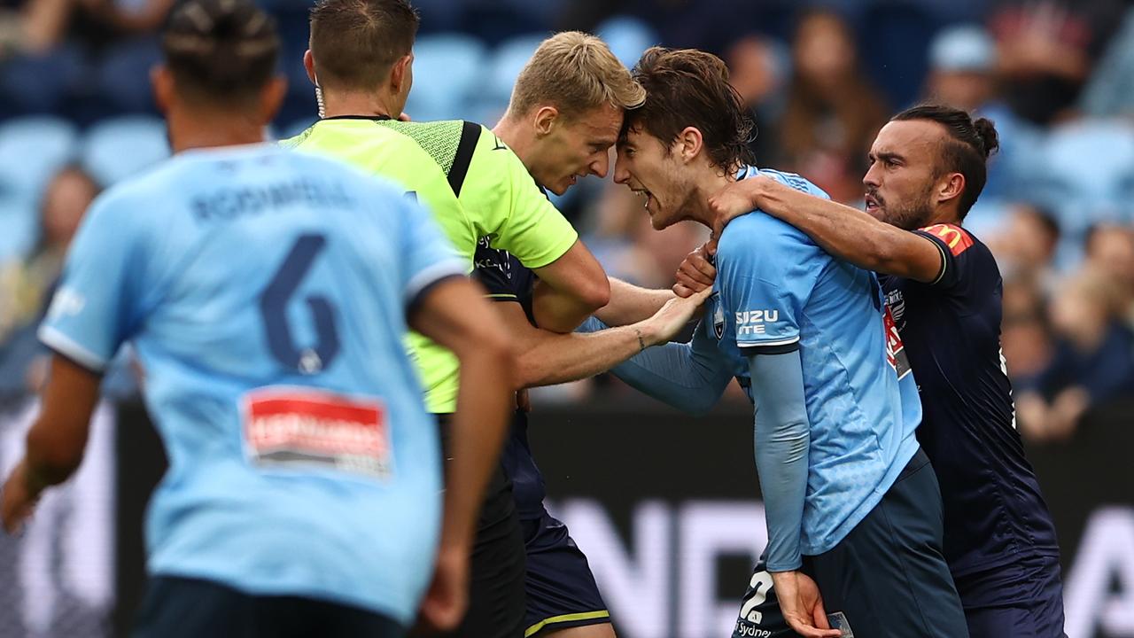 Nicholas Pennington of the Phoenix and Max Burgess of Sydney FC clash during the round 11 A-League Men's match between Sydney FC and Wellington Phoenix at Allianz Stadium. Picture: Matt Blyth