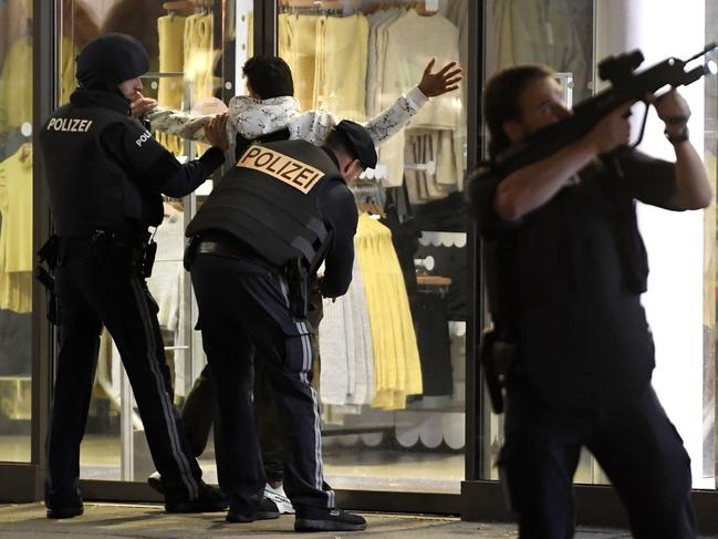 Police control a person at Mariahilferstrasse in central Vienna following a shooting near a synagogue. Picture: AFP