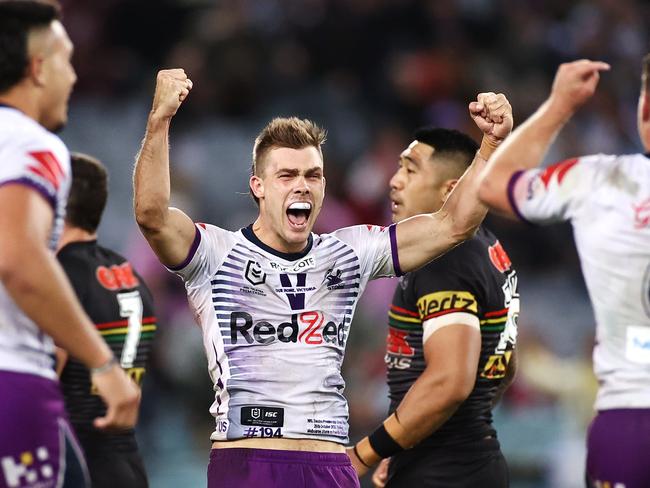 SYDNEY, AUSTRALIA - OCTOBER 25: Ryan Papenhuyzen of the Storm and Cameron Munster of the Storm celebrate winning the 2020 NRL Grand Final match between the Penrith Panthers and the Melbourne Storm at ANZ Stadium on October 25, 2020 in Sydney, Australia. (Photo by Cameron Spencer/Getty Images)