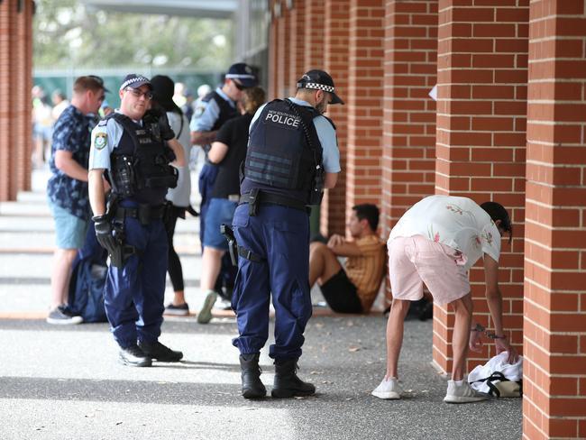 Police talk to a man with handcuffs on outside Festival X, The Dome, Homebush, Sydney. 30th November, 2019. Picture by Damian Shaw