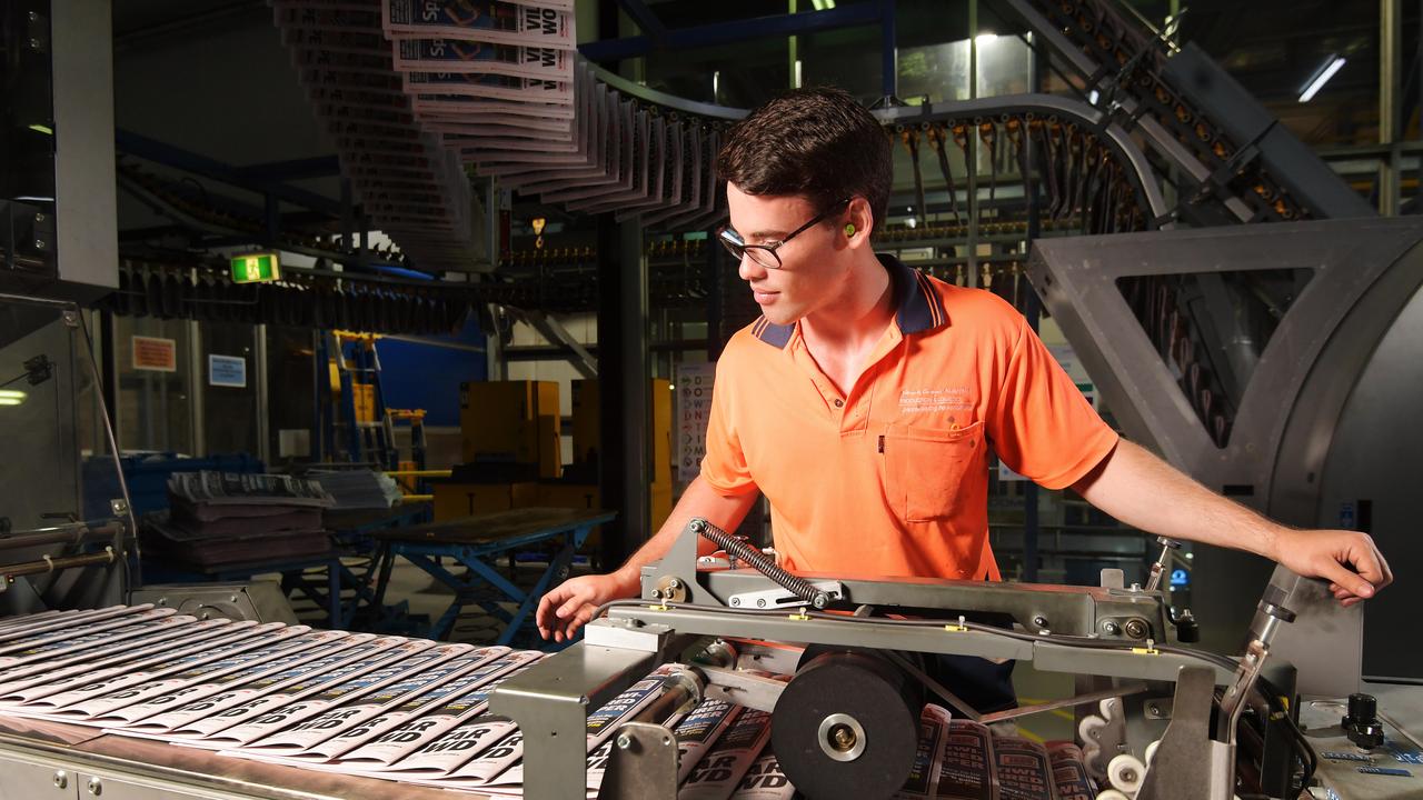 NT News inserter Joel Thomas looks at the paper during the printing process. Pictures: KERI MEGELUS