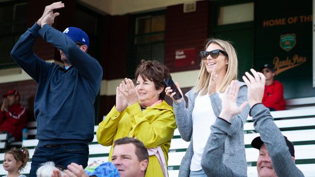 His wife Candice Falzon applauds her husband David Warner as he reaches 100. Picture: Luke Drew