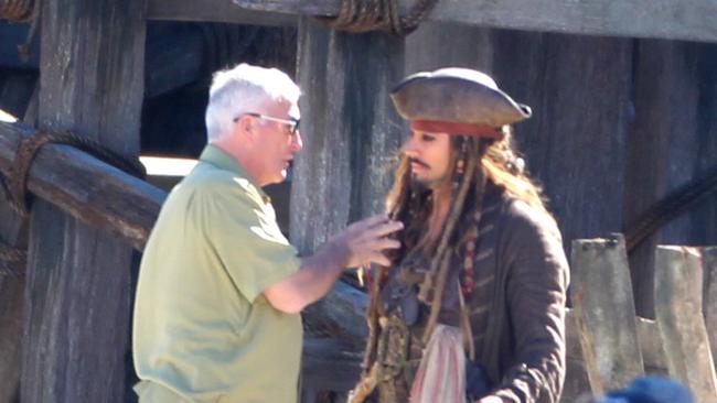 Johnny Depp's bodyguard Jerry Judge talks to Depp's double on the set of Pirates of the Caribbean: Dead Men Tell No Tales at The Spit. Picture: Tim Marsden