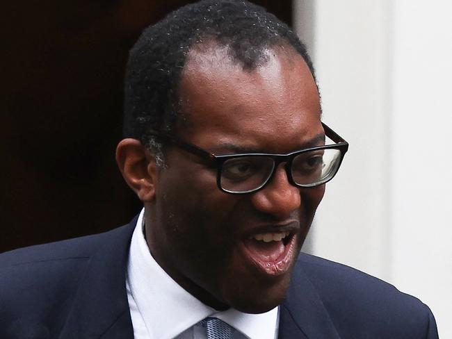 Britain's dismissed Chancellor of the Exchequer Kwasi Kwarteng walks out of Number 11 Downing Street in central London on October 14, 2022. - British Prime Minister Liz Truss dismissed her finance minister, forcing Kwasi Kwarteng to carry the can for turmoil sparked by her right-wing economic platform as restive Conservatives plotted her own demise. (Photo by ISABEL INFANTES / AFP)