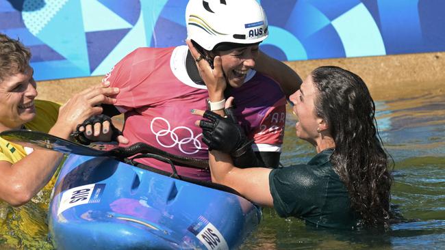 Jess, right, congratulates her sister, Noemie, after winning gold in the women's canoe slalom competition at Vaires-sur-Marne Nautical Stadium during the Paris Olympic Games in August. Picture: AFP