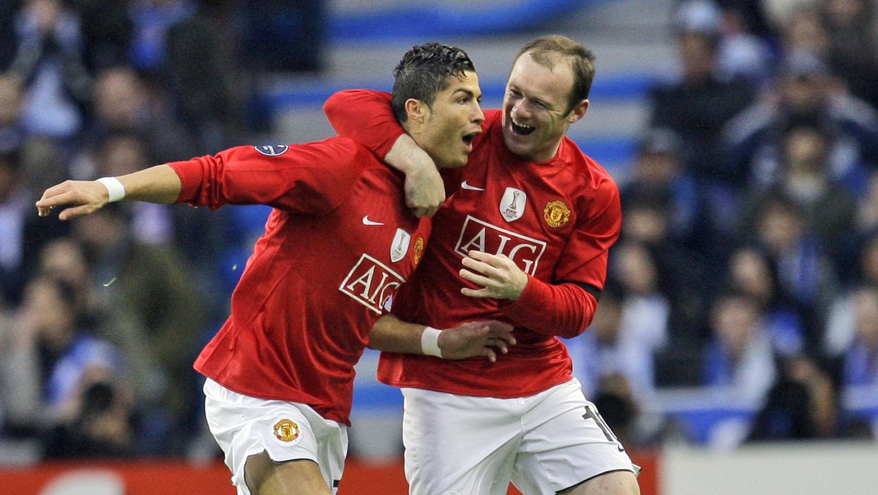 Manchester United's Cristiano Ronaldo, left, celebrates with Wayne Rooney