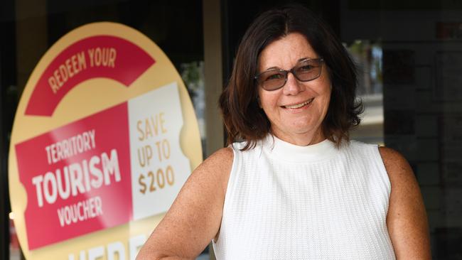 Debbie Riley has been trying to use her tourism voucher to book a Matt Wright experience online for about week, but problems with the voucher scheme website prompted her to visit Top End Tourism in person this morning. Picture: Katrina Bridgeford