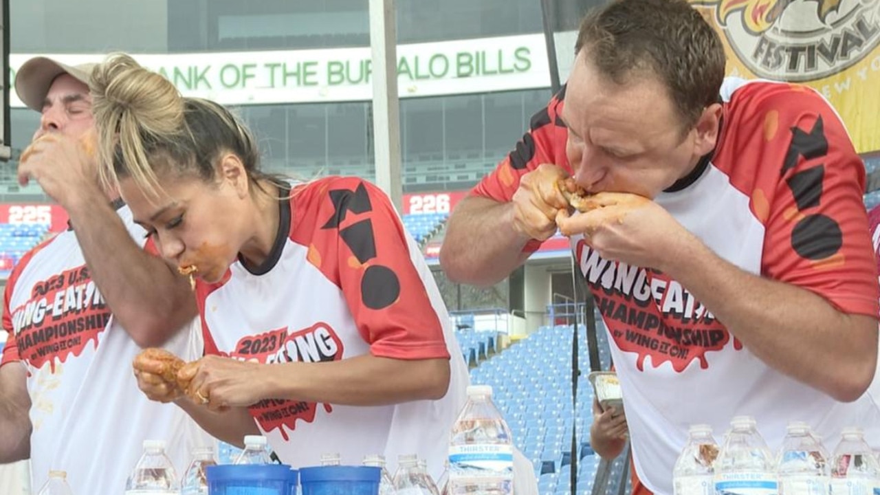 Two-time reigning queen of the wing competition Miki Sudo and world No. 1 competitive eater Joey Chestnut competing in the Wing It On! US Chicken Wing Eating Championship at Highmark Stadium in New York State.