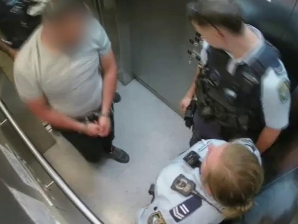 Police pictured with one of the men after the kidnapping. Picture: NSW Police