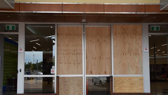 The boarded-up front entrance to the Palmerston Shopping Centre on Sunday after the mayhem of violence on Saturday night