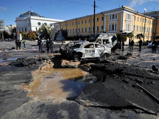 Police officers examine destroyed cars in the centre of Ukrainian capital of Kyiv. Picture: AFP