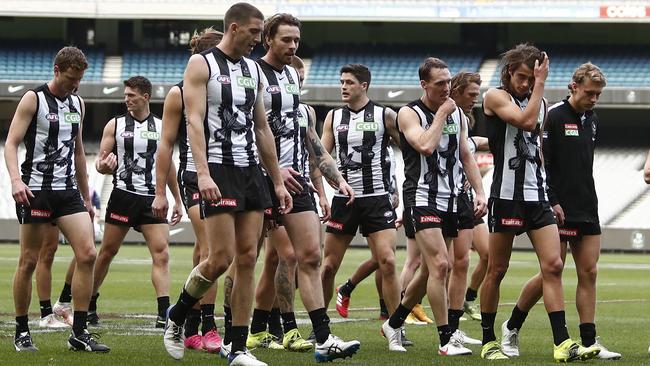 Collingwood players leave the field after the first-half disaster against the Cats. Picture: AFL Photos/Getty Images