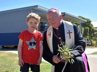 Max Challenor of St. John's Kindy wanted to be the first in his class to meet Bishop Robert McGukin. Picture: Jorja McDonnell