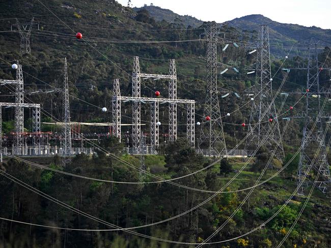 High-voltage transmission towers carrying electricity from Spain to Portugal are pictured near the border, in Lindoso, Portugal, on April 28, 2025. Spanish Prime Minister Pedro Sanchez said today authorities were not ruling out any  cause for the widespread blackout across the Iberian pensisula. 
