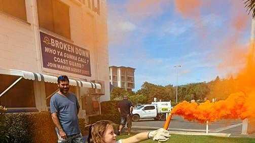 Piper Mills using the orange smake flare. Picture: Yeppoon Coast Guard