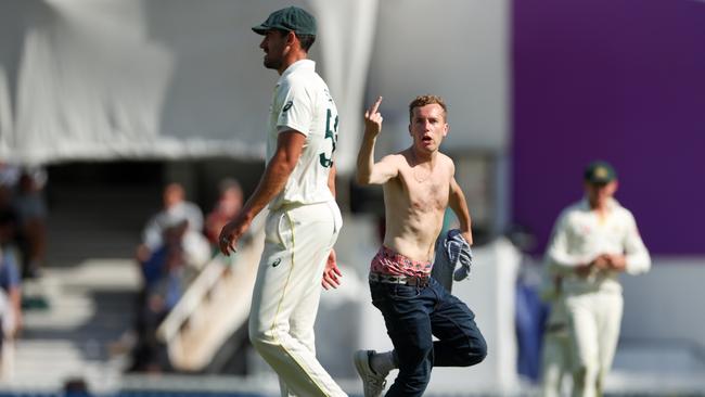 A spectator runs onto the field. Picture: Getty