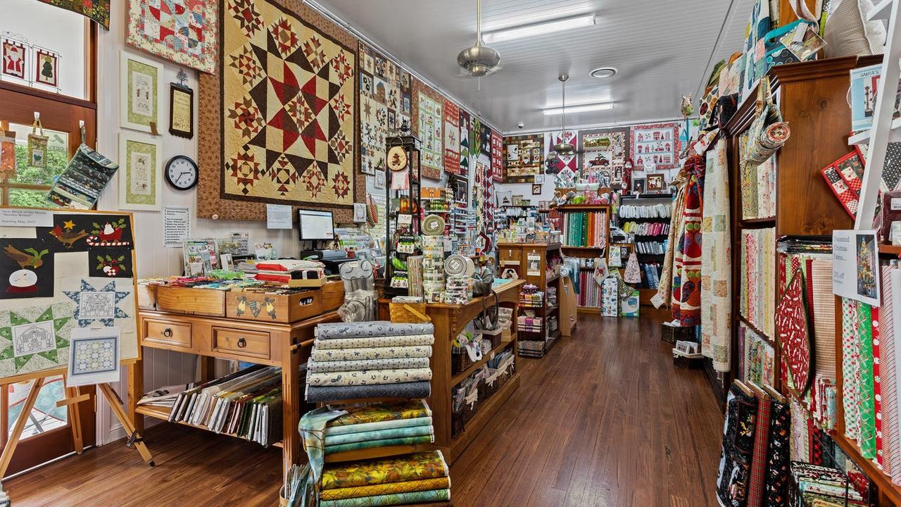 Inside the world class Glenrose Patchwork shop with its walls lined by owner Glenis Pugliese's handmade goods.