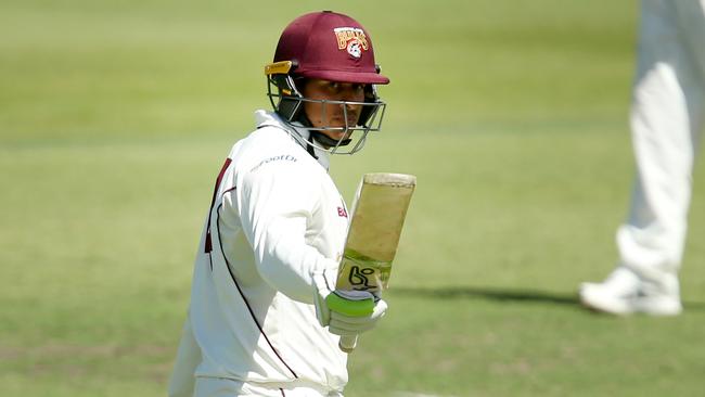 Usman Khawaja salutes after reaching his half century.