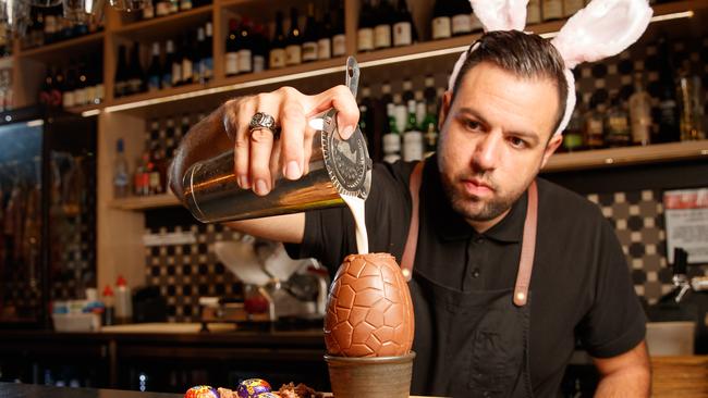 De Sa mixes a Cadbury Creme Egg flavoured Cocktail at one of his former places of employment. Picture: Matt Turner.