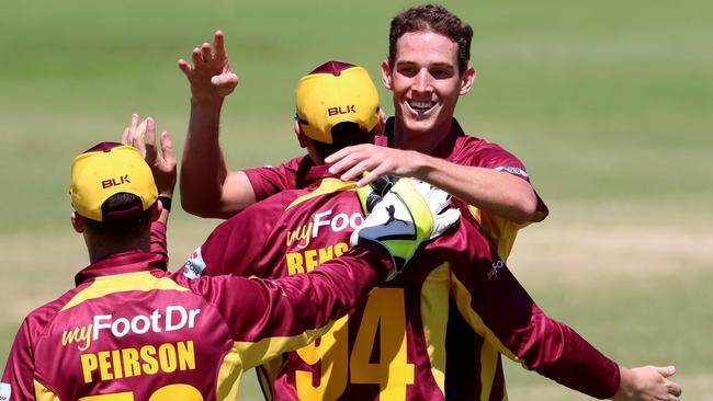 Queensland Bulls bowler Peter George celebrates taking the wicket of William Bosisto of the CA XI on Saturday.