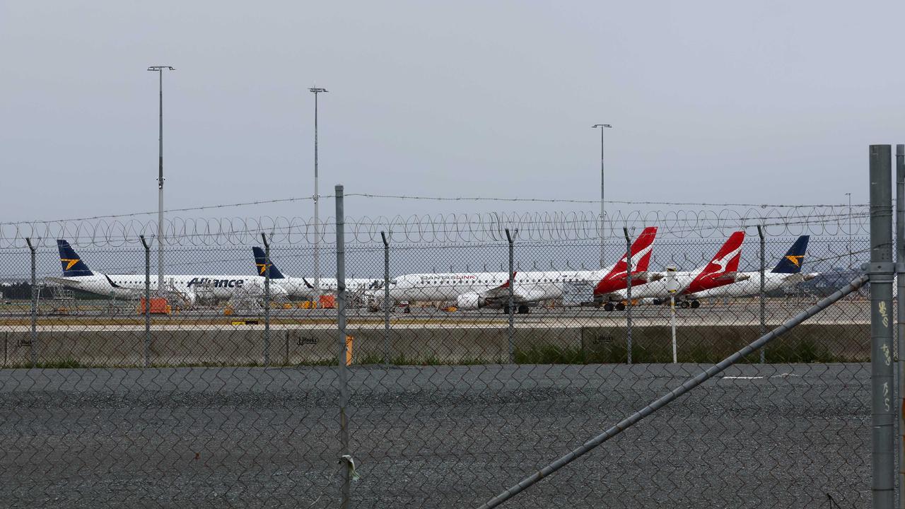 Aircraft parked at Brisbane Airport after all flights were cancelled ahead of Cyclone Alfred. Picture: NewsWire/Tertius Pickard