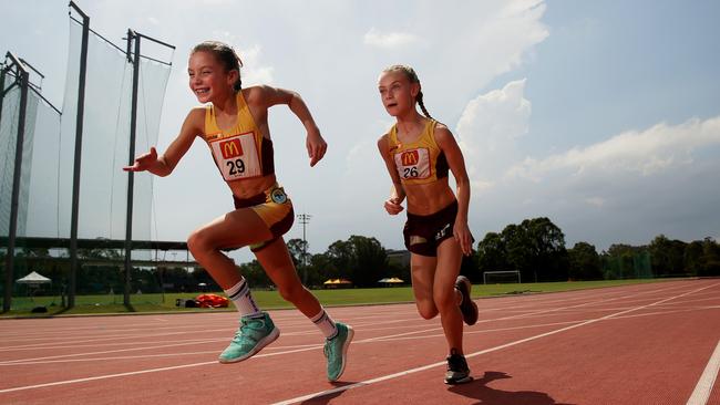 Hills Athletics Academy members Talahn Paki, 10, and Gabriella Liaropoulos, 11, at the Sydney West Regional Athletics Carnival at Blacktown International Sportspark.