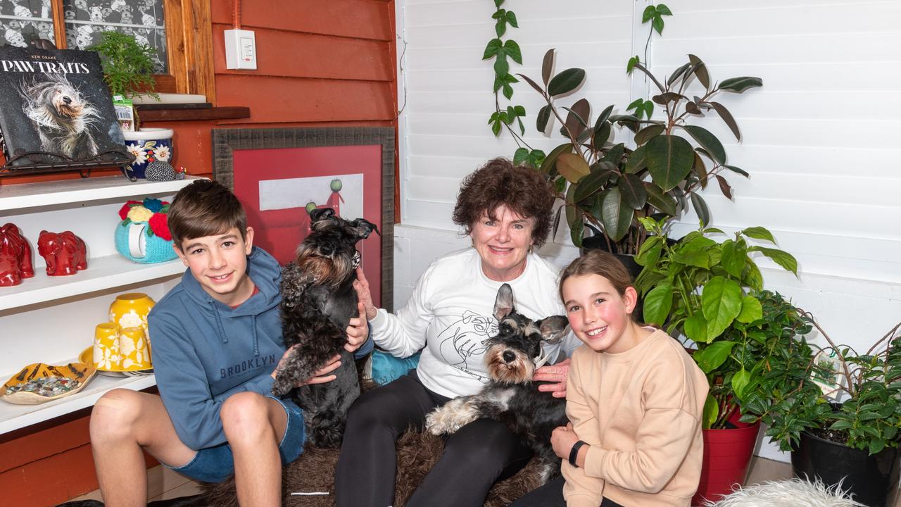 Judith Predebon started Schnauzerhaus in 2019, after the idea came to her "like a bolt out of the blue." Here she is with Sophia Diem and dog Dr Vestas, as well as Andre Diem holding Clark Gable demonstrating what typical clients can experience in a session.