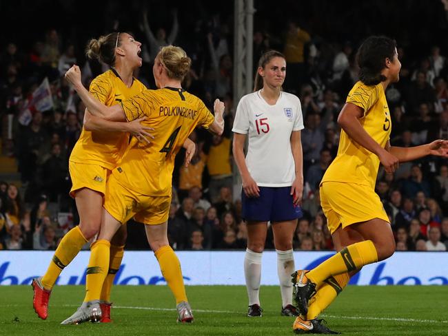 LONDON, ENGLAND - OCTOBER 09: Clare Polkinghorne of Australia celebrates after she scores her sides first goal  during the International Friendly between England Women and Australia Women at Craven Cottage on October 9, 2018 in London, England. (Photo by Catherine Ivill/Getty Images)