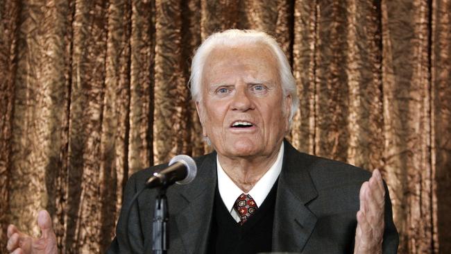 (FILES) In this file photo taken on June 21, 2005 Evangelist Billy Graham takes questions at a  press conference in New York to announce his Billy Graham Crusade. The body of Reverend Billy Graham, a spiritual advisor to several presidents, will lie in the US Capitol Rotunda next week so Americans can pay respect to the globally influential preacher, lawmakers said February 22, 2018.The rare honor of placing an American's remains in the Capitol is usually reserved for US presidents, military officials and politicians.  Graham, who died February 21, 2018 at age 99, would be only the fourth private citizen so honored, and the first person since US senator Daniel Inouye in 2012.  / AFP PHOTO / Timothy A. CLARY