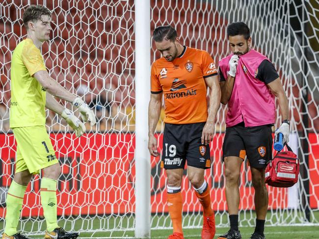 Jack Hingert of the Roar leaves the field injured during the Round 18 A-League match between Brisbane Roar and Sydney FC at Suncorp Stadium in Brisbane, Friday, February 8, 2019. (AAP Image/Glenn Hunt) NO ARCHIVING, EDITORIAL USE ONLY