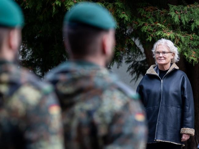 KAUNAS, LITHUANIA - OCTOBER 08: German Defense Minister Christine Lambrecht watches during the inauguration of the new German Vigilance Activities Brigade on October 8, 2022 near Rukla, Lithuania. Germany leads a NATO contingent in Lithuania. The new Vigilance Activities Brigade is part of efforts by NATO to increase its capabilities across its eastern flank. (Photo by Paulius Peleckis/Getty Images)