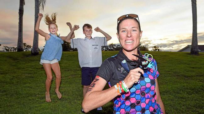 MISSION ACCOMPLISHED: Hervey Bay's Katrina Tate had the full support of her children Tilly, 10, and Link, 12, completing her first Ironwoman event in Cairns at the weekend. Picture: Cody Fox