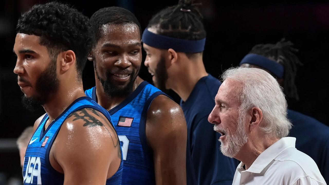 USA's coach Gregg Popovich (R) and USA's Kevin Durant react after the win over Spain.