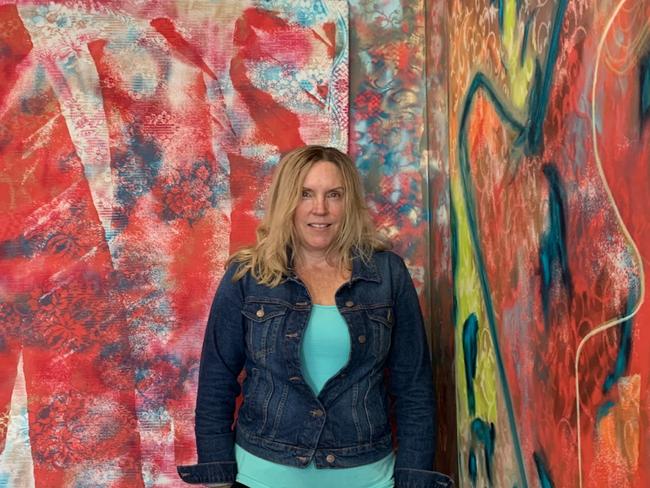 Cathy Condon in front of her painting 'Red Jacket'. Picture: supplied.