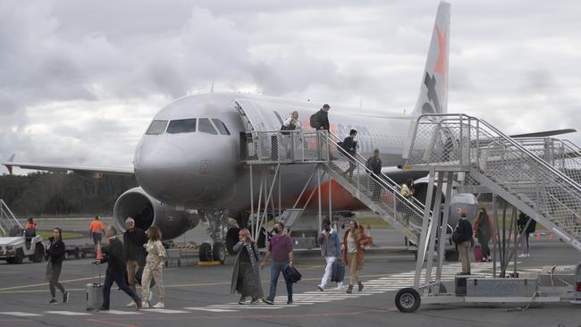 People disembark a domestic Jetstar flight at the Ballina-Byron Gateway Airport on June 20, 2020. (Photo by Brook Mitchell/Getty Images)