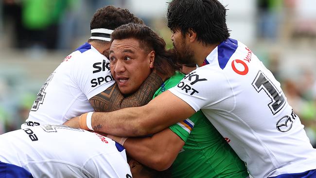 Josh Papalii is wrapped up by the Warriors defence. Picture: Mark Nolan/Getty Images