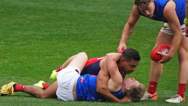 Neville Jetta and Charlie Spargo wrestle during a Melbourne Demons intra club match that was held at the MCG after the game against Essendon was postponed Picture: AAP