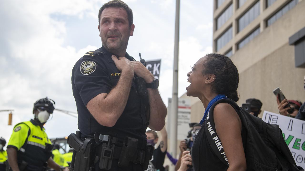 A protester yells at an Atlanta Police Department Officer after they both were hit with pepper spray during a protest in Atlanta, Friday, May 29, 2020. Picture: Alyssa Pointer/Atlanta Journal-Constitution via AP