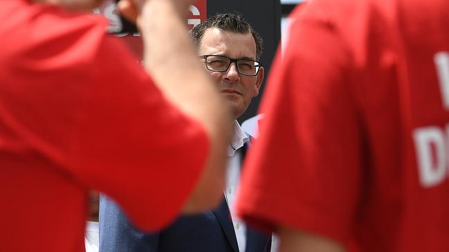 Victorian Premier Daniel Andrews seen alongside Labor Party supporters wearing red shirts in 2018. Picture: AAP Image/Julian Smith