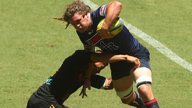 Rebels flanker Jordy Reid looks to bust a tackle at the Global Tens on Saturday. Picture: Getty Images